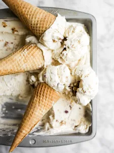 No Churn Honey Salted Almond Ice Cream Recipe By The Wood and Spoon Blog By Kate Wood. This is a no-churn recipe made with sweetened condensed milk, whipped cream, and clover honey. The nuts are cooked baked in butter and salt. Each bite of ice cream is sweet and salty, very creamy and almost naturally sweetened. Make the whole recipe in less than 30 minutes, very fast and easy. Recipe on thewoodandspoon.com