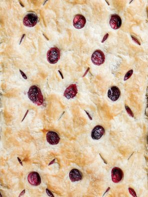 Berry Slab Pie by Wood and Spoon Blog. This is a triple berry pie with blueberries raspberries and strawberries, scented with cinnamon and layered flat in a sheet pan. This summer pie serves a crowd and has an all-butter pie crust. This make ahead dessert is great for outdoor parties and picnics. Learn how to make this lattice on thewoodandspoon.com